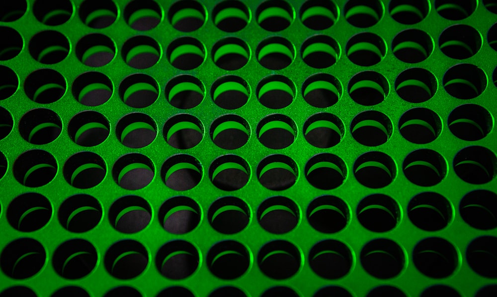 green and black polka dot textile