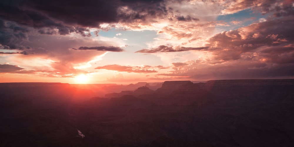 silhouette of mountains during sunset