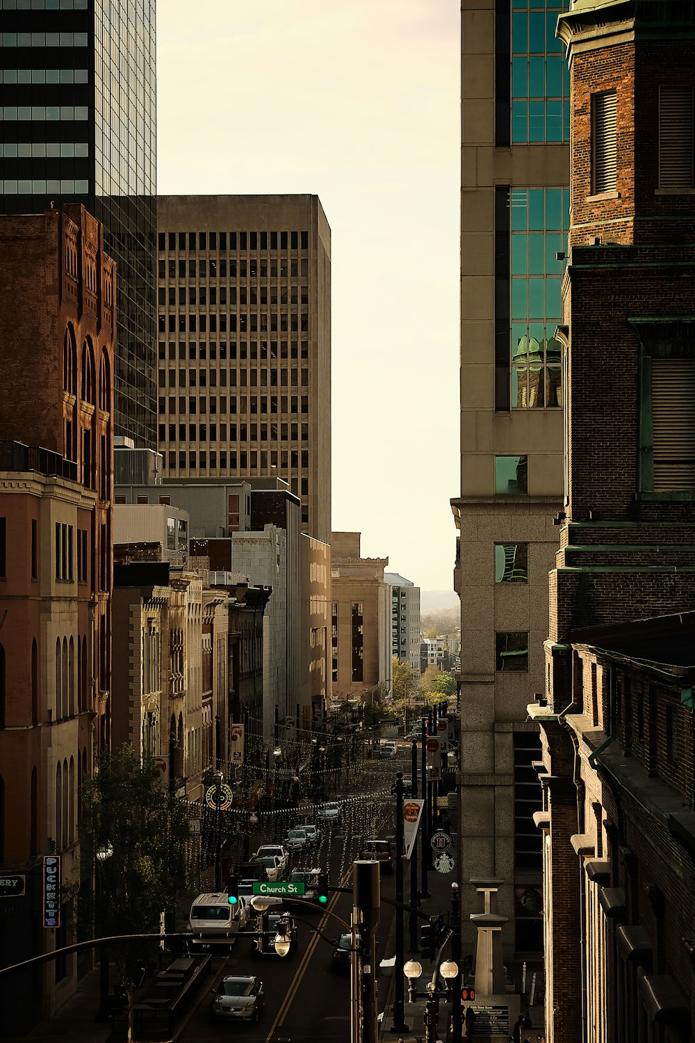 people walking on street between high rise buildings during daytime