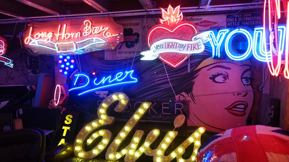 a neon sign with a woman's face on it