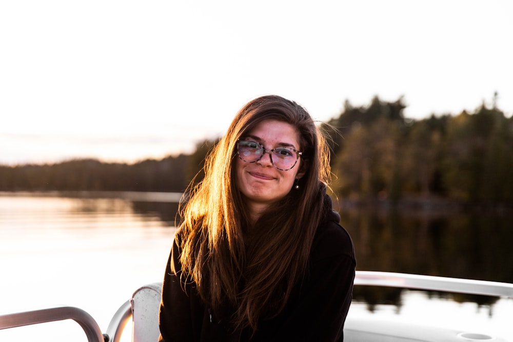 woman in black jacket wearing eyeglasses