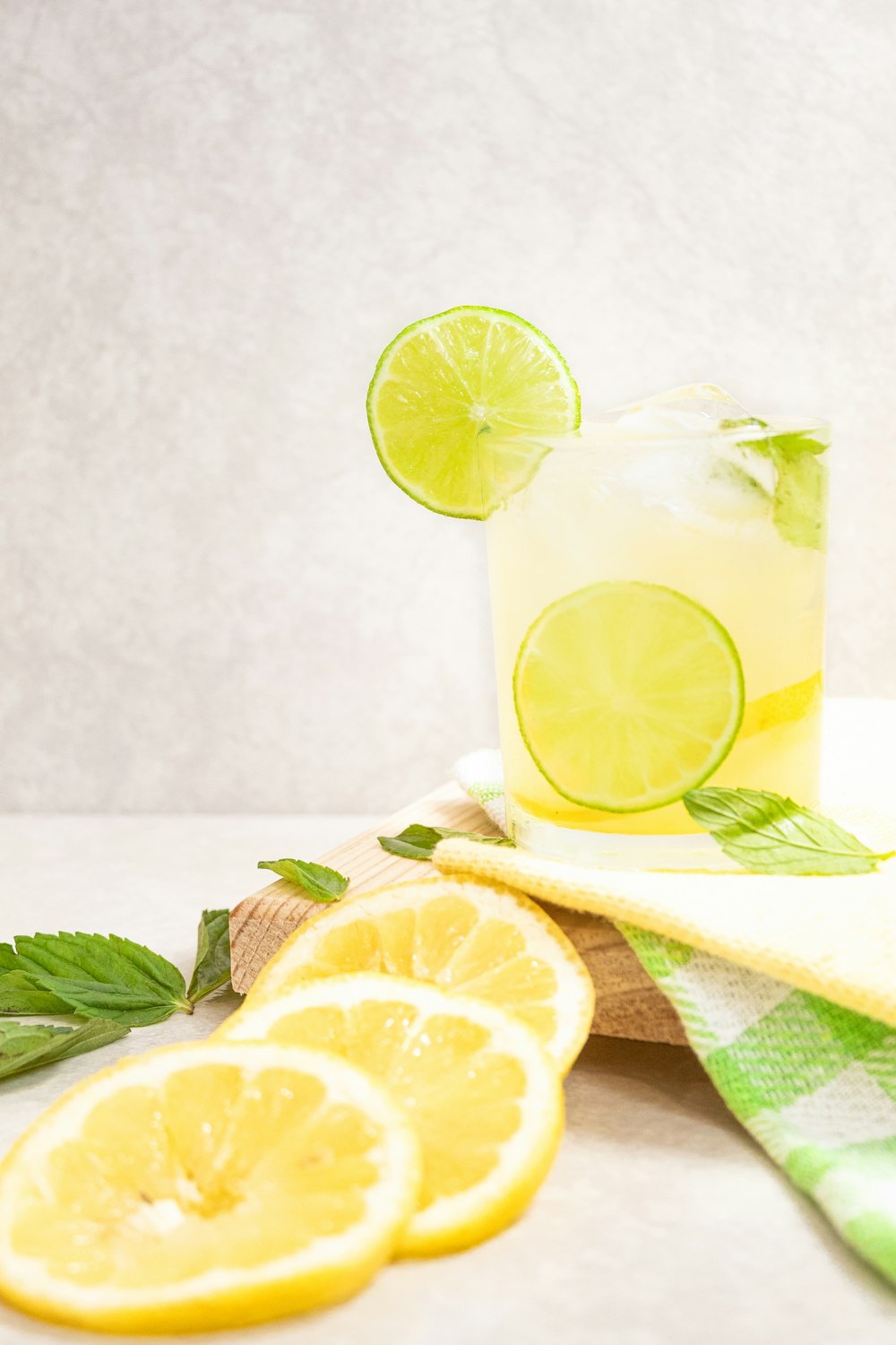 sliced lemon on brown wooden chopping board