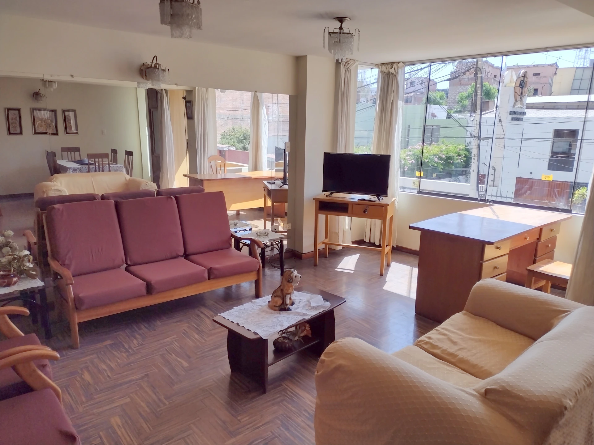 A bright, modern living room in an Ayala Land Avida ready-for-occupancy home, featuring large windows and stylish furniture.