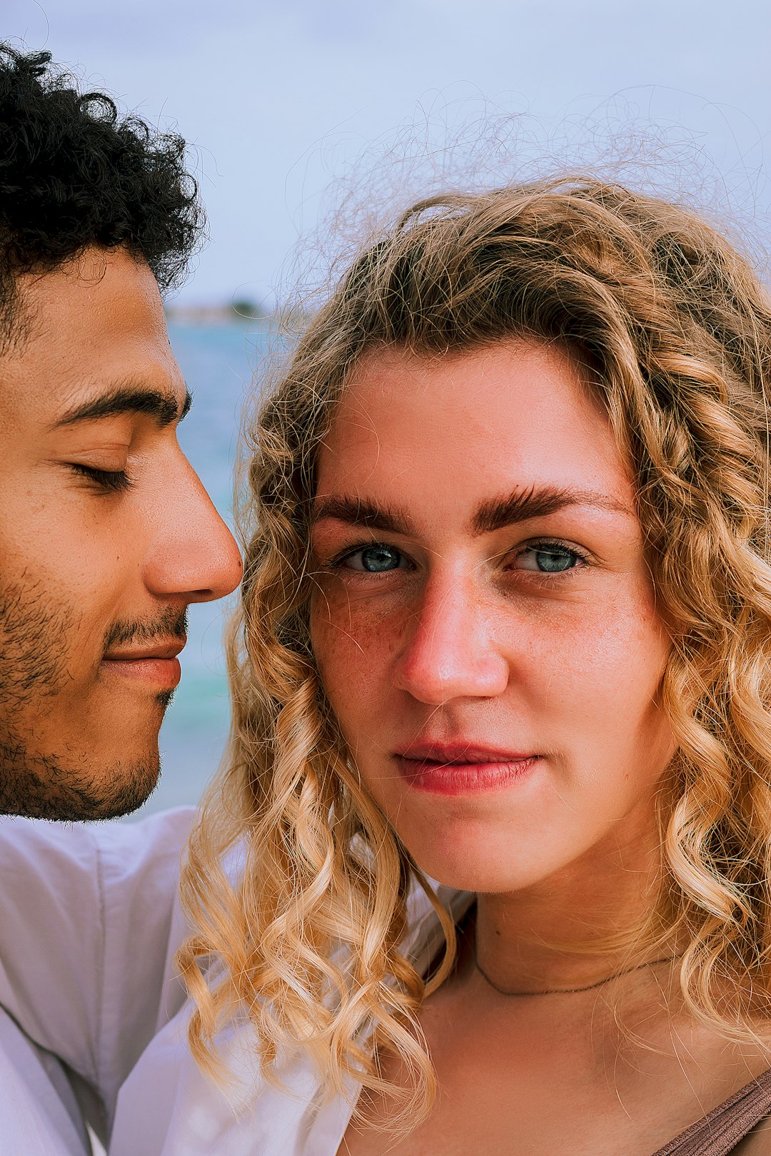 man in white crew neck shirt beside woman in white shirt