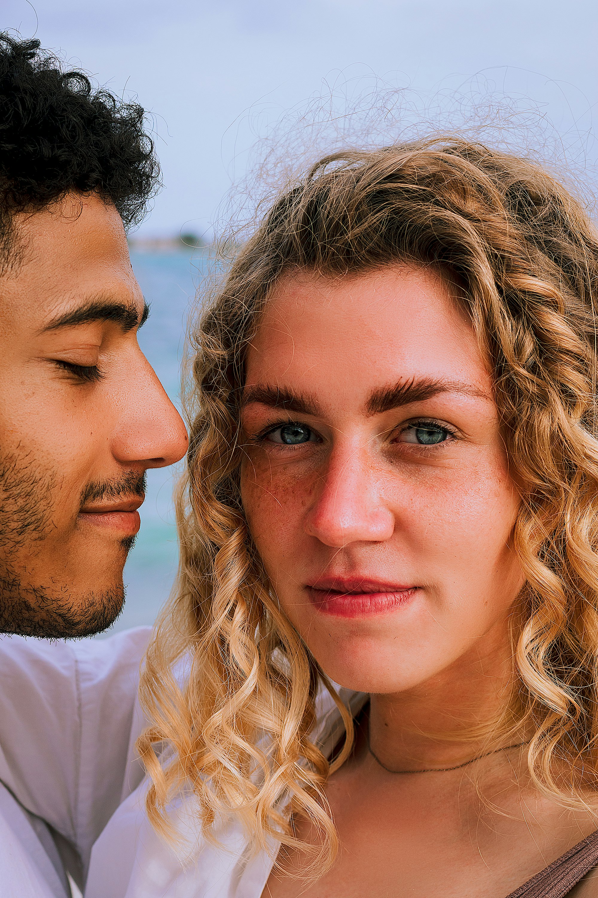 man in white crew neck shirt beside woman in white shirt