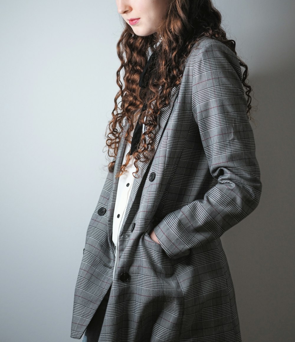 woman in black and white checkered blazer