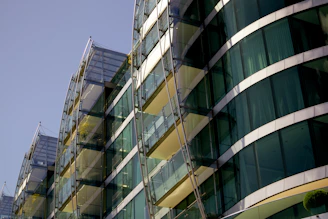 A sleek glass building with green accents reflecting the vibrant startup energy at NIT Srinagar.