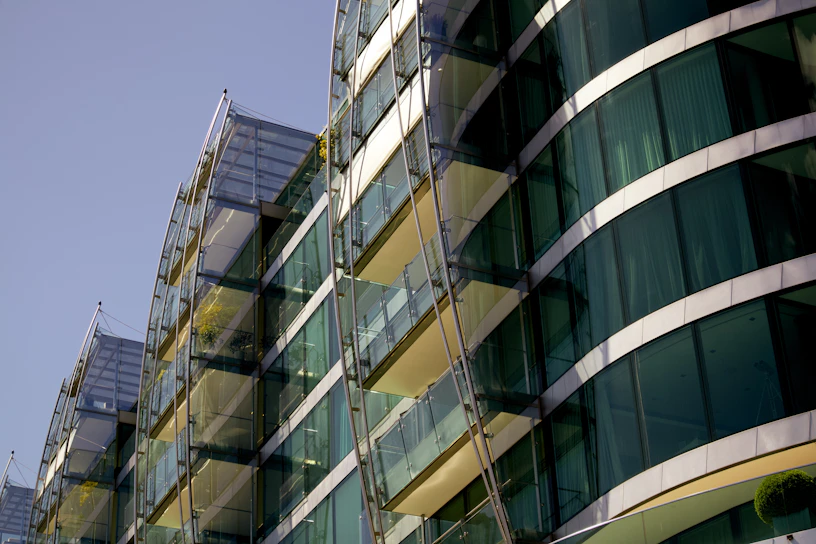A sleek glass building with green accents reflecting the vibrant startup energy at NIT Srinagar.