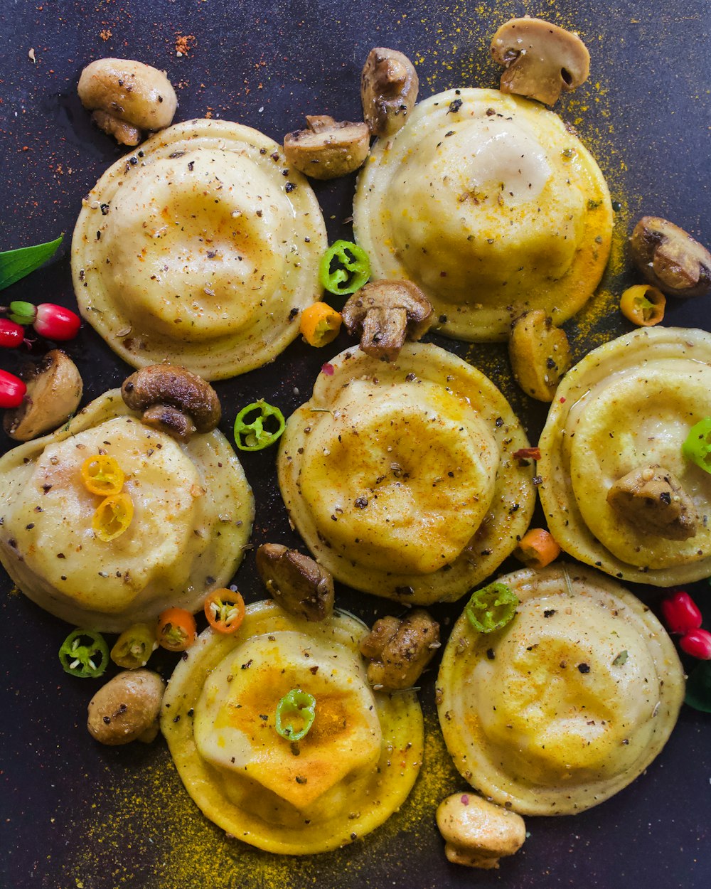 cooked food on black round plate