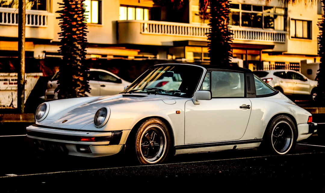 white porsche 911 parked on street during night time