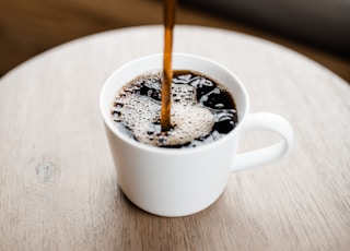 white ceramic mug with coffee