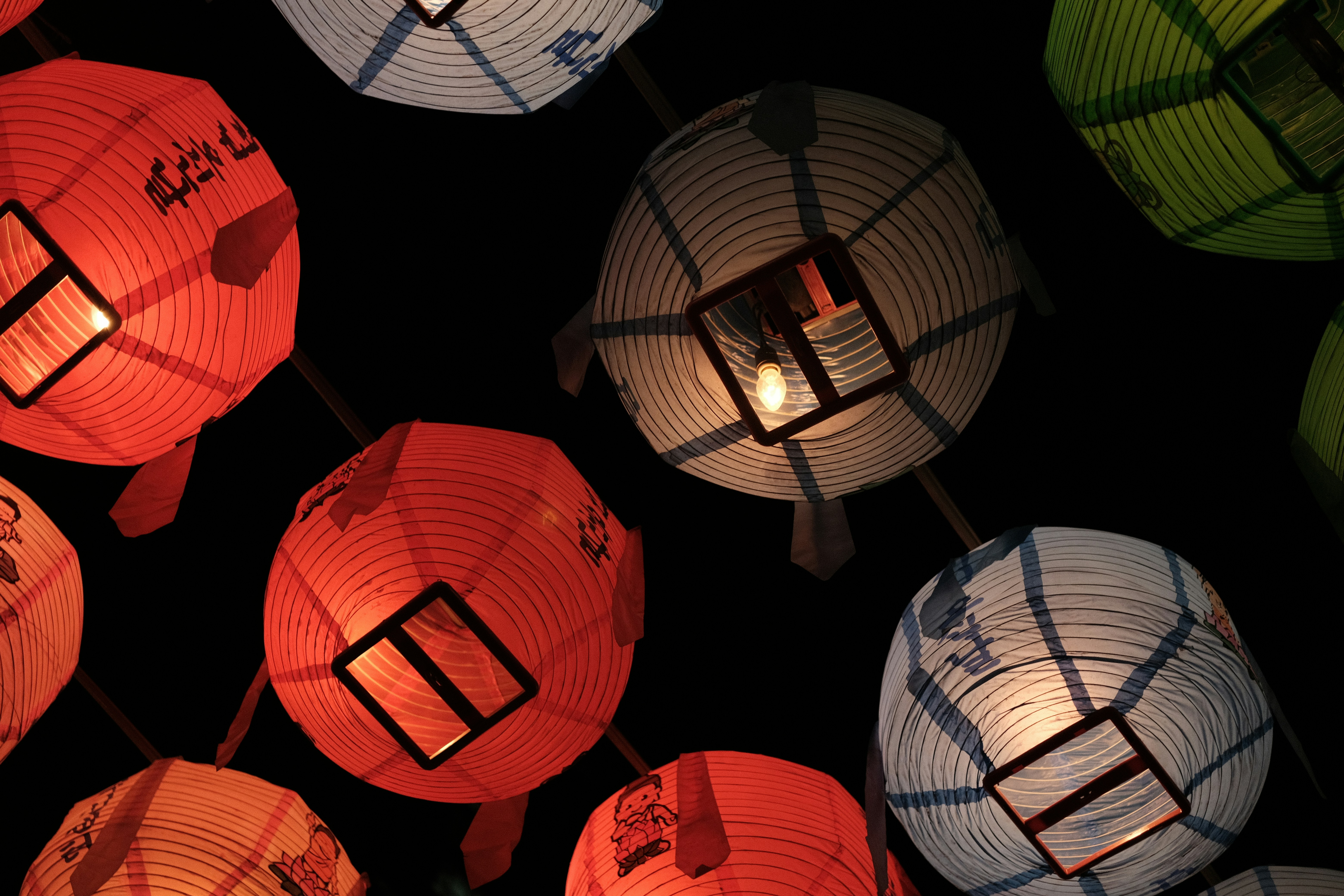 red paper lanterns on dark room