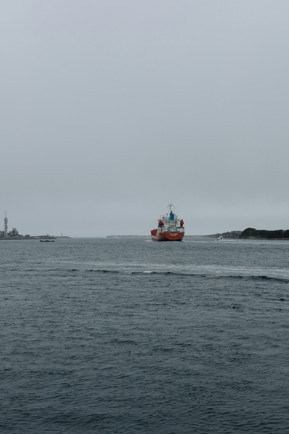 red and white boat on sea during daytime