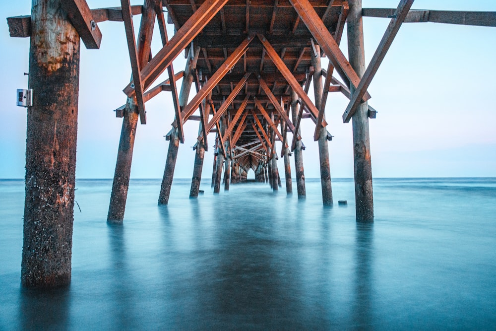 brown wooden dock on sea during daytime