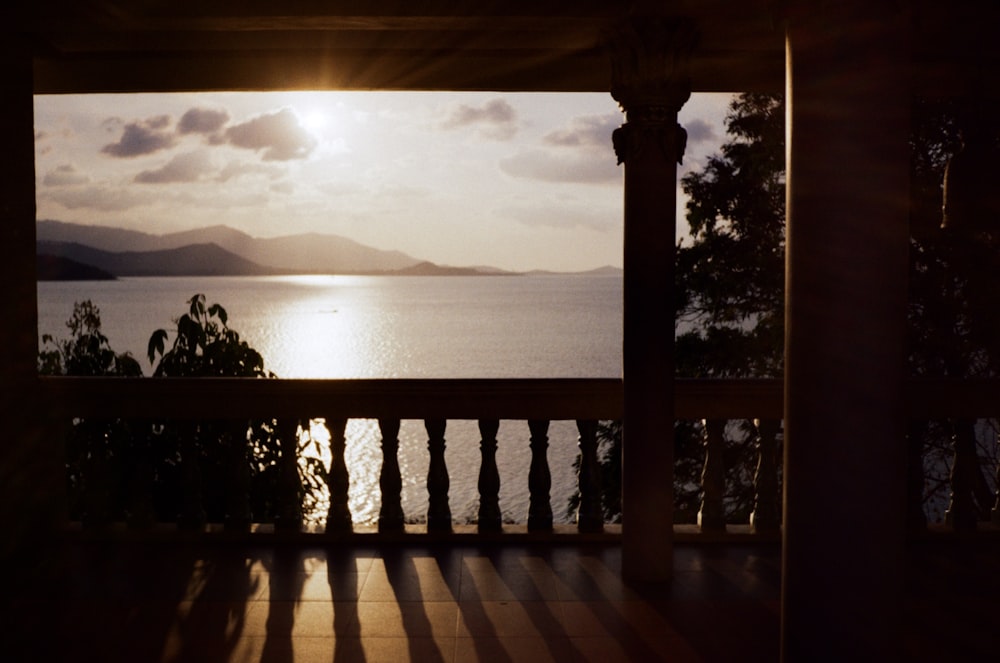 silhouette of mountain near body of water during daytime