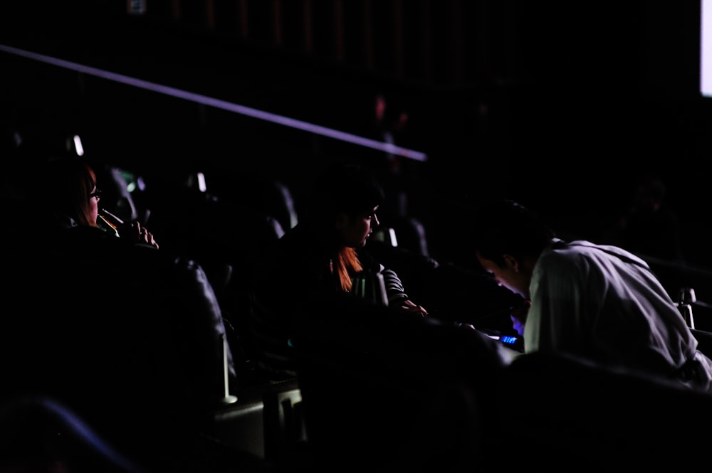 people sitting on chair inside room