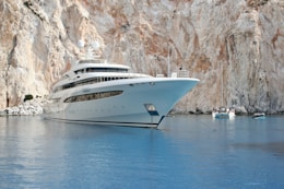 white and blue cruise ship on blue sea during daytime