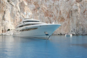 white and blue cruise ship on blue sea during daytime