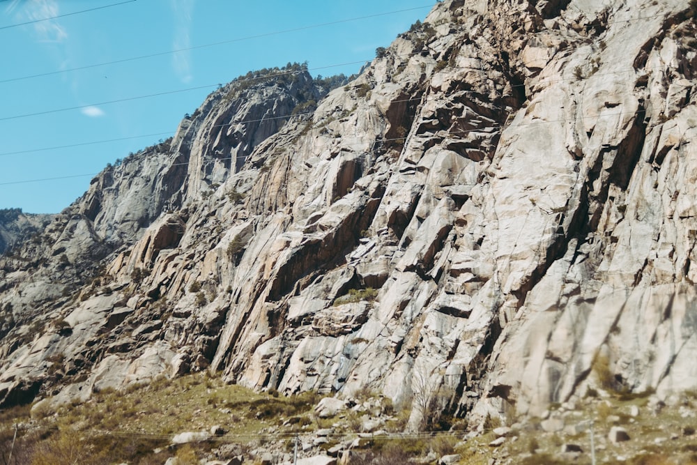 brown rocky mountain under blue sky during daytime