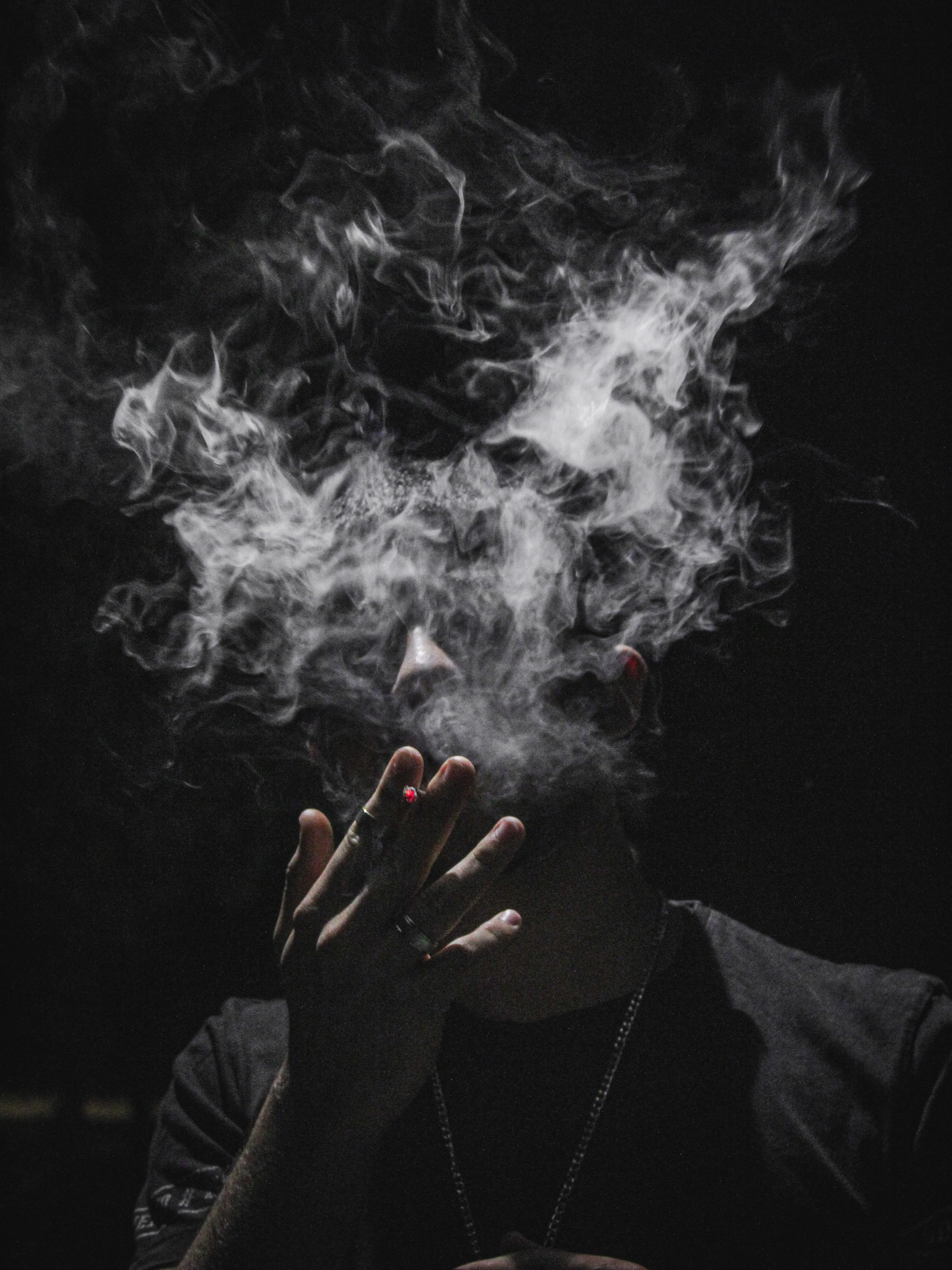 guy smoking cigarette Black Images Handsome young man smoking cigar