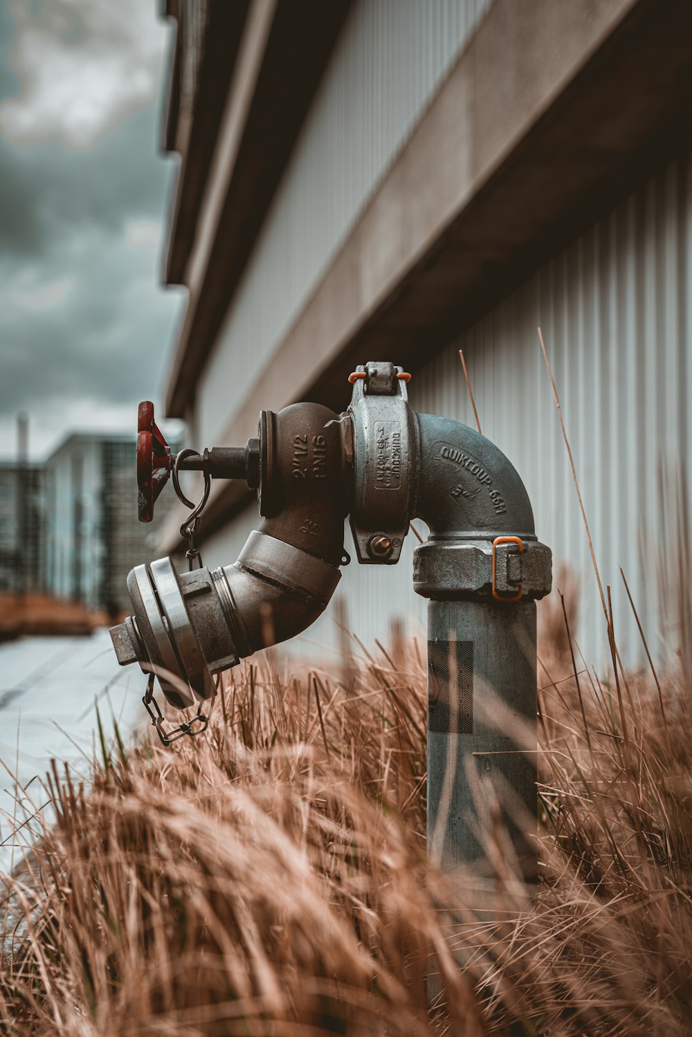 black and silver dslr camera on brown grass during daytime