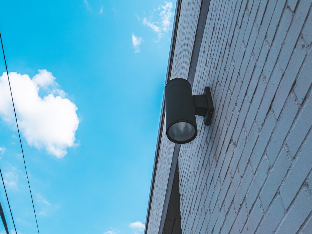 black outdoor lamp on white wall