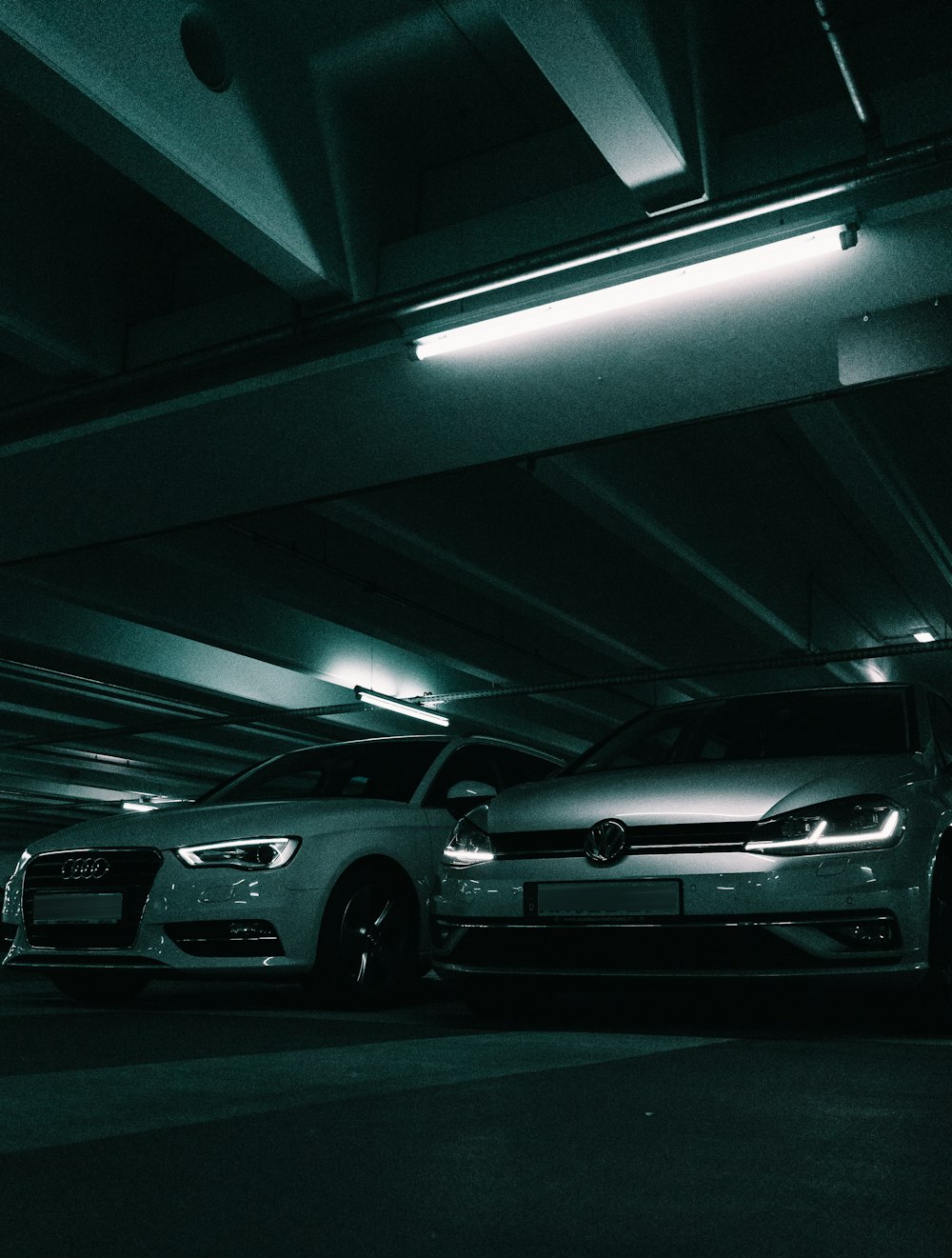 silver sedan parked in parking lot