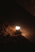 A beautiful outdoor lamp lighting up a garden pathway.