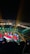 A vibrant performance stage at Axe Music Fest with colorful lights.