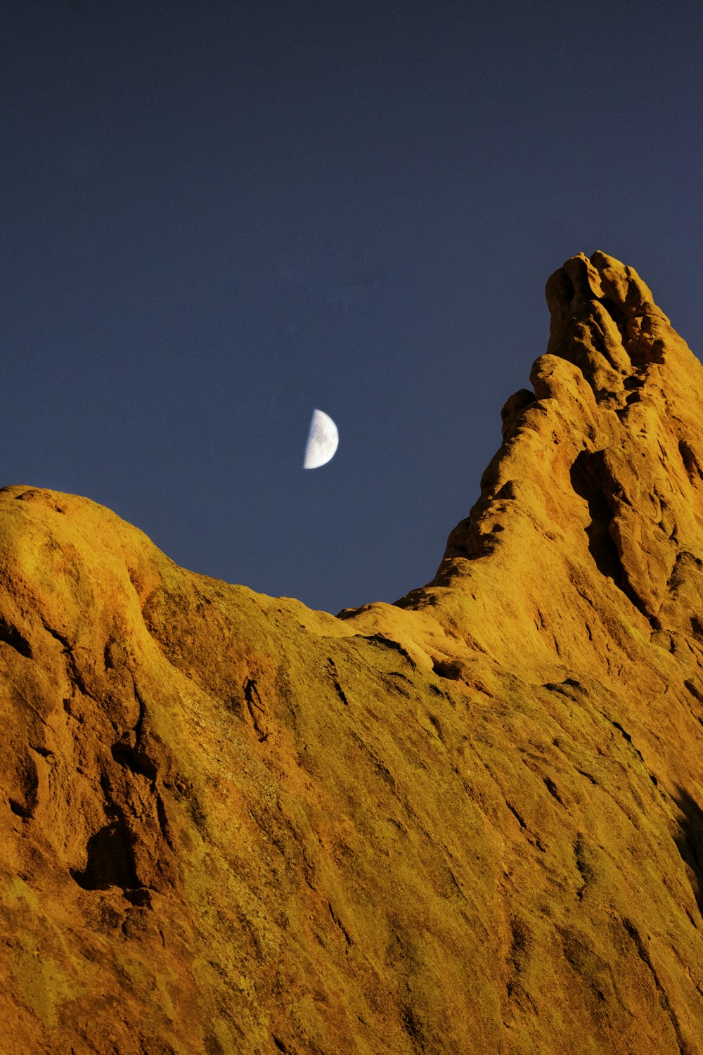 brown rock formation under blue sky during daytime