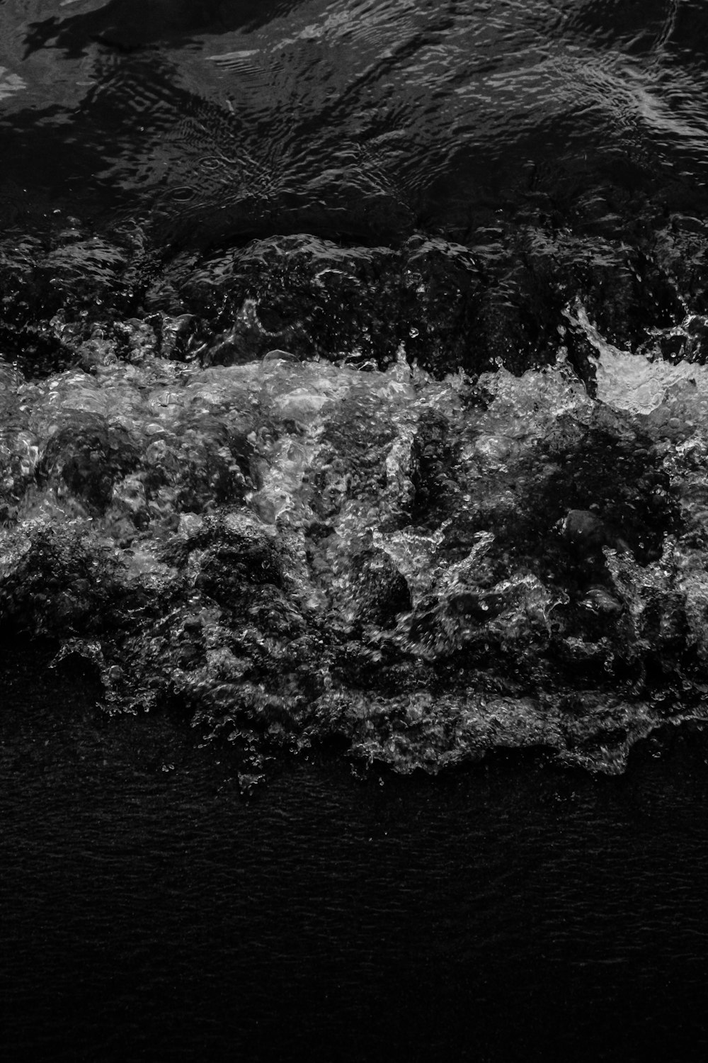 grayscale photo of water splash