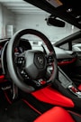 black and red car steering wheel
