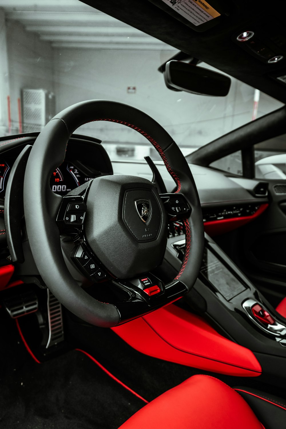 black and red car steering wheel