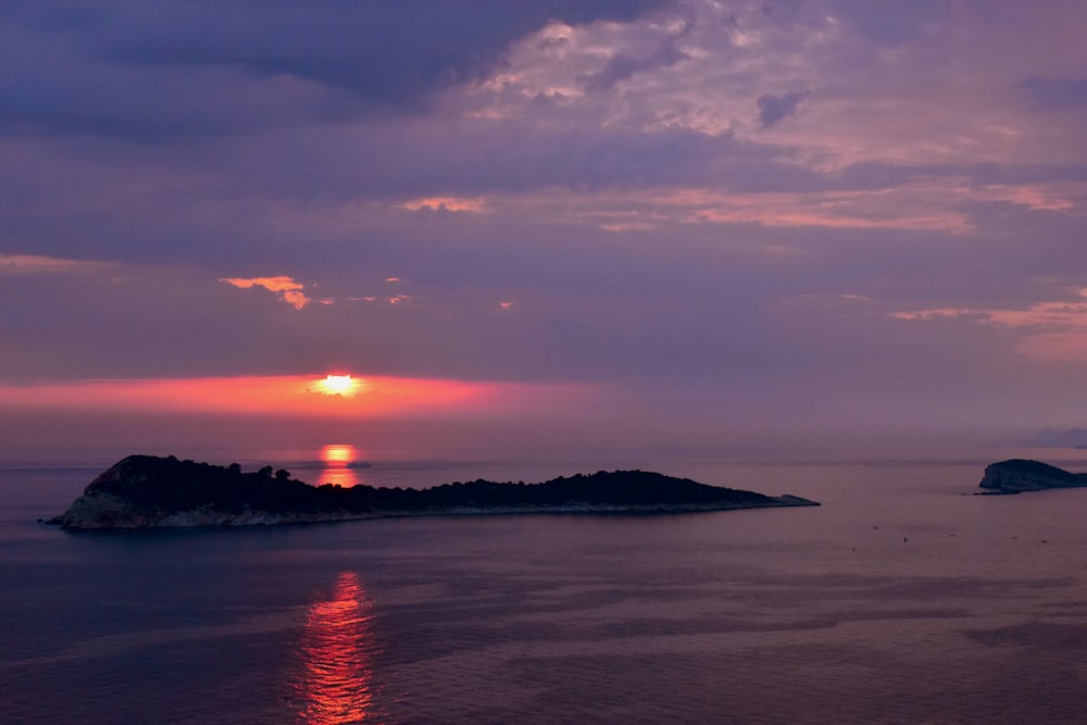 body of water during sunset