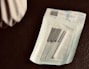 white paper on brown textile