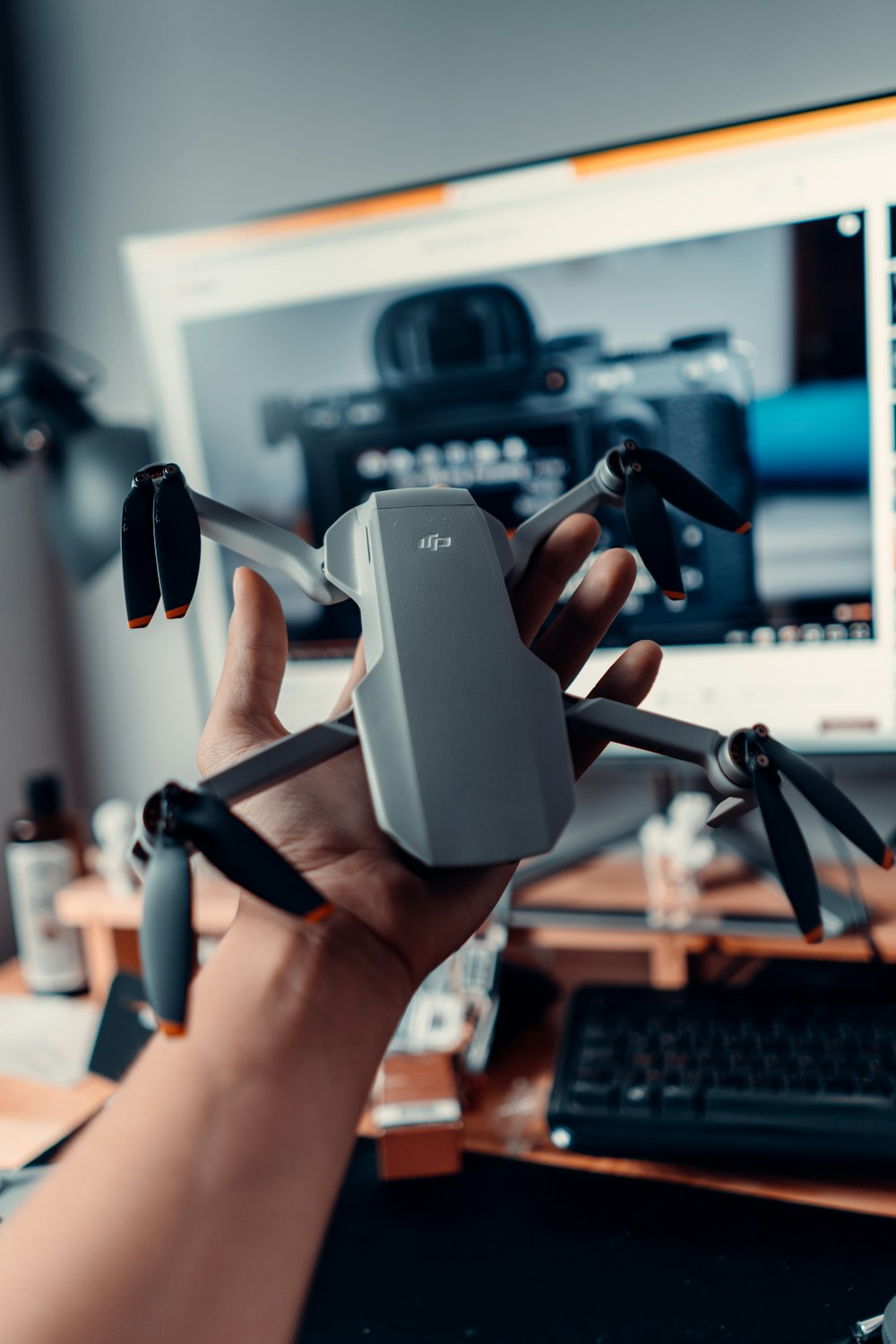 person holding gray and black vr headset