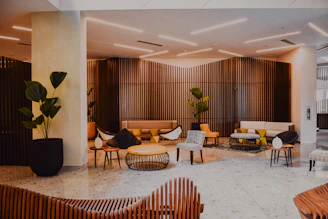 modern hotel lobby with designer furniture and wood walls