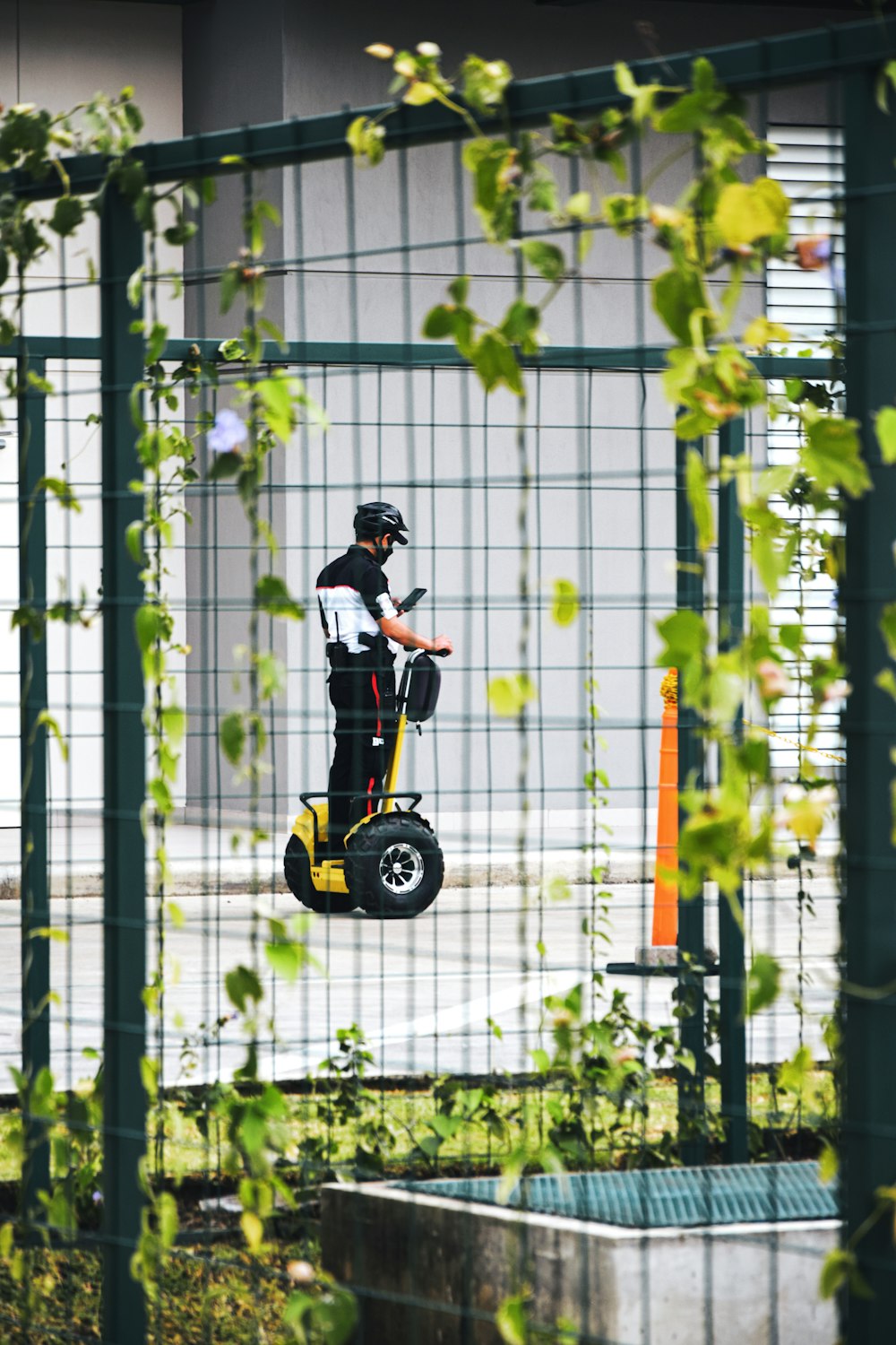 boy in red shirt riding yellow and black bicycle