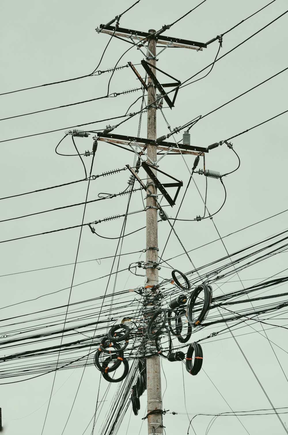 brown wooden electric post during daytime