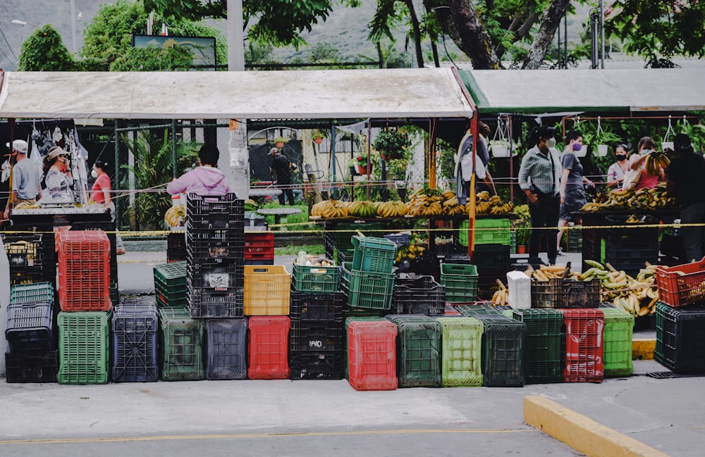 green and red plastic crates on gray concrete floor