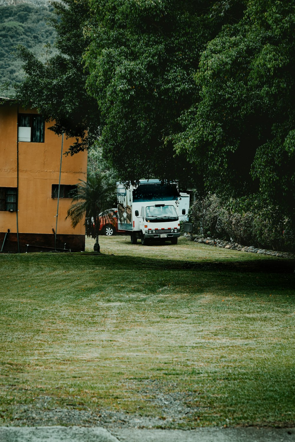 white truck parked near brown building