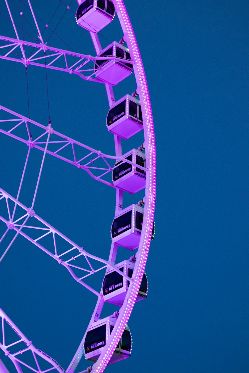 white and black ferris wheel under blue sky during daytime