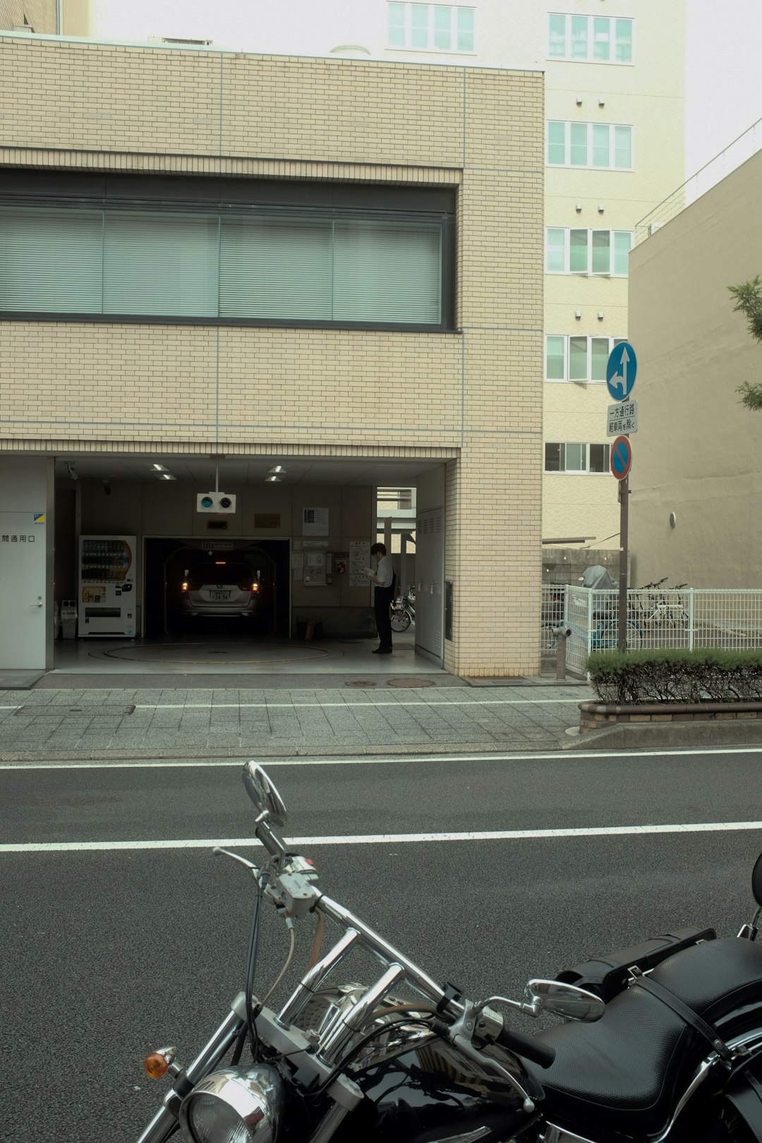 man in black jacket riding bicycle on road during daytime