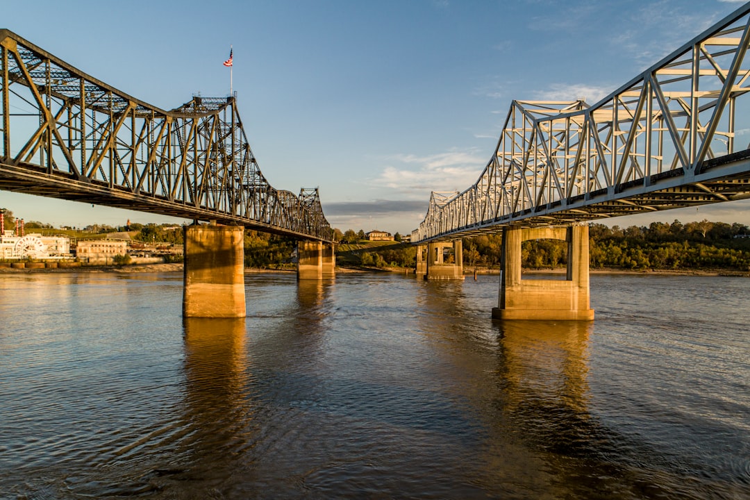 gray bridge over body of water during daytime