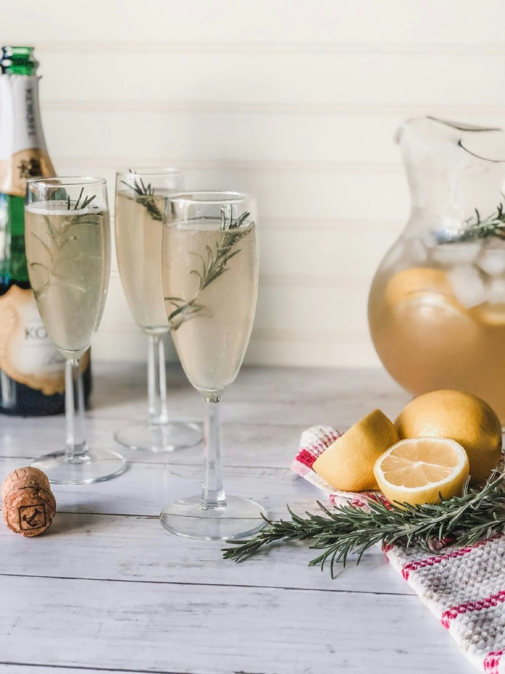 clear glass pitcher with lemon juice