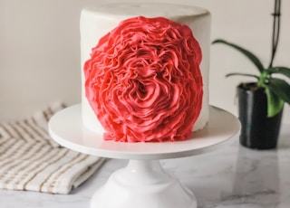 red and white cake on white ceramic plate