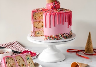 pink and white cake on white ceramic plate