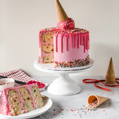 pink and white cake on white ceramic plate