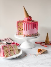 pink and white cake on white ceramic plate