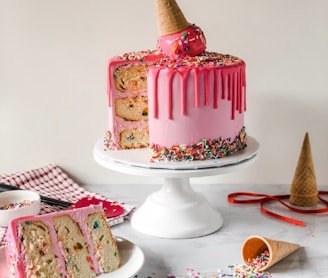 pink and white cake on white ceramic plate